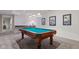 Finished basement boasting a billiards table and stylish wall decor at 2953 Foxborough Dr, Greenwood, IN 46143