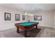 Finished basement with a classic billiards table and unique wall decor at 2953 Foxborough Dr, Greenwood, IN 46143