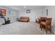 Finished basement with exercise bike, comfortable seating area, and a game table with chairs at 2953 Foxborough Dr, Greenwood, IN 46143