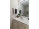 Bathroom vanity with a white countertop, gold hardware, and a decorative mirror at 2953 Foxborough Dr, Greenwood, IN 46143