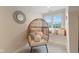 Cozy bedroom nook with a unique hanging chair, decorative pillows, and a bright window seat at 2953 Foxborough Dr, Greenwood, IN 46143