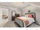 Comfortable bedroom featuring soft carpet, a dark wood dresser, and a metal bed frame at 2953 Foxborough Dr, Greenwood, IN 46143