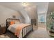 Cozy bedroom with unique sloped ceilings, a window seat, and an iron bed frame at 2953 Foxborough Dr, Greenwood, IN 46143