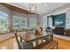 Dining room features a wood table, window bench and backyard view at 2953 Foxborough Dr, Greenwood, IN 46143