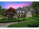 Charming single-Gathering home showcasing manicured landscaping and a welcoming entrance at twilight at 2953 Foxborough Dr, Greenwood, IN 46143