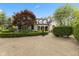 A charming home entrance and a beautiful landscape can be seen in the front yard at 2953 Foxborough Dr, Greenwood, IN 46143