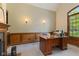 Spacious home office with natural light, custom woodwork, and a professional setup, ideal for productivity at 2953 Foxborough Dr, Greenwood, IN 46143