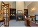 Cozy home office featuring custom built-ins, fireplace, and a rich, inviting color palette at 2953 Foxborough Dr, Greenwood, IN 46143