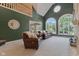 Bright living room featuring an open floor plan, large windows, and views of the outdoor pool at 2953 Foxborough Dr, Greenwood, IN 46143