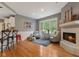 Cozy living area features a fireplace, recessed lights, and hardwood floors at 2953 Foxborough Dr, Greenwood, IN 46143