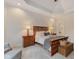 Comfortable main bedroom featuring a tray ceiling, soft carpet, and wood furniture at 2953 Foxborough Dr, Greenwood, IN 46143