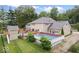 Aerial view of backyard with swimming pool, deck, and playhouse at 2971 N Buck Creek Rd, Greenfield, IN 46140