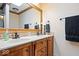 Bathroom featuring a double vanity with a large mirror and decorative backsplash at 2971 N Buck Creek Rd, Greenfield, IN 46140