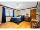 Bedroom features hardwood floors, crown molding, and a cozy blue patterned quilt at 2971 N Buck Creek Rd, Greenfield, IN 46140