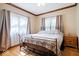 Comfortable bedroom with hardwood floors, natural light and a queen sized bed at 2971 N Buck Creek Rd, Greenfield, IN 46140