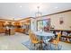 Open dining area with tile flooring, stylish light fixture, and views of the kitchen and outdoor deck at 2971 N Buck Creek Rd, Greenfield, IN 46140