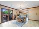 Dining area with natural light, tile floors, and access to a deck area at 2971 N Buck Creek Rd, Greenfield, IN 46140