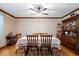 Traditional dining room features wooden table and chairs, with a classic china cabinet at 2971 N Buck Creek Rd, Greenfield, IN 46140