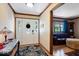 Inviting entryway with decorative glass door, patterned rug, and hardwood flooring leading into the living area at 2971 N Buck Creek Rd, Greenfield, IN 46140