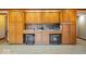 Kitchen with light wood cabinets and a countertop area with seating beneath at 2971 N Buck Creek Rd, Greenfield, IN 46140