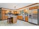 Well-equipped kitchen with oak cabinets, stainless steel appliances, a center island, and tile flooring at 2971 N Buck Creek Rd, Greenfield, IN 46140