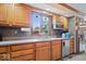 Close-up of a kitchen with stainless steel appliances, tiled backsplash, and custom cabinetry offering lots of storage at 2971 N Buck Creek Rd, Greenfield, IN 46140