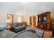 Open concept living room featuring comfortable seating, hardwood floors, and natural light at 2971 N Buck Creek Rd, Greenfield, IN 46140