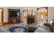 Cozy living room showcasing a fireplace, entertainment center, and comfortable furnishings at 2971 N Buck Creek Rd, Greenfield, IN 46140