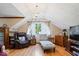 Inviting sitting room with elegant chandelier, hardwood floors, and ample natural light at 2971 N Buck Creek Rd, Greenfield, IN 46140