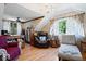 Sitting room featuring hardwood floors, chandelier, and a cozy chaise lounge at 2971 N Buck Creek Rd, Greenfield, IN 46140