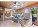 Inviting sunroom with wood finishes and views to the kitchen and outdoors at 2971 N Buck Creek Rd, Greenfield, IN 46140