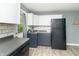 Bright kitchen featuring stylish cabinets, stainless steel appliances, and hardwood flooring at 305 W Vinyard St, Anderson, IN 46011