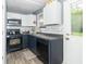Updated kitchen with modern appliances, sleek countertops, and ample cabinet space at 305 W Vinyard St, Anderson, IN 46011