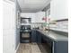 Well-lit kitchen with stainless steel appliances, white subway tile backsplash, and modern fixtures for a functional design at 305 W Vinyard St, Anderson, IN 46011