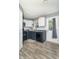 Functional kitchen with stainless steel appliances, white cabinets, and ample counter space, perfect for cooking at 305 W Vinyard St, Anderson, IN 46011
