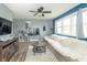 Cozy living room with natural light, ceiling fan, and stylish decor, providing a comfortable and inviting space at 305 W Vinyard St, Anderson, IN 46011