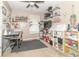 Office space with organized crafting supplies, shelves, and desk area at 305 W Vinyard St, Anderson, IN 46011