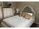 Inviting bedroom with a decorative headboard, plush pillows, and elegant furnishings at 308 Bay Ridge Dr, Pendleton, IN 46064