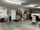 Spacious garage with plenty of room for parking, storage, and a convenient utility sink area at 308 Bay Ridge Dr, Pendleton, IN 46064