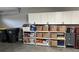 Garage with ample storage cabinets and shelving to keep your space organized and clutter-free at 308 Bay Ridge Dr, Pendleton, IN 46064
