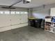 Spacious garage with a white door and overhead lighting, providing secure parking and storage solutions at 308 Bay Ridge Dr, Pendleton, IN 46064