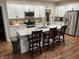 Spacious kitchen featuring white cabinets, stainless appliances, and stone countertops at 308 Bay Ridge Dr, Pendleton, IN 46064
