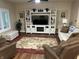 Comfortable living room with a large entertainment center and plush seating, perfect for relaxation at 308 Bay Ridge Dr, Pendleton, IN 46064