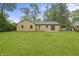 Well-maintained backyard with a brick house, perfect for outdoor at 3526 Westfield Dr, Anderson, IN 46011