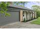 Charming brick home with an attached garage and inviting covered front porch at 3526 Westfield Dr, Anderson, IN 46011
