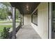 Inviting covered front porch featuring an overhang supported by columns and recessed lighting at 3526 Westfield Dr, Anderson, IN 46011