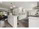 Spacious kitchen with an island, white cabinetry, stainless appliances, and a connected dining area at 3526 Westfield Dr, Anderson, IN 46011