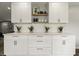 Contemporary kitchen with white cabinets, decorative accents, and sleek hardware at 3526 Westfield Dr, Anderson, IN 46011