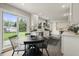 Open concept kitchen with sleek white cabinetry, stainless steel appliances, and a view to the backyard at 3526 Westfield Dr, Anderson, IN 46011