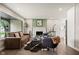 Comfortable living room with a fireplace, large window, and stylish decor at 3526 Westfield Dr, Anderson, IN 46011
